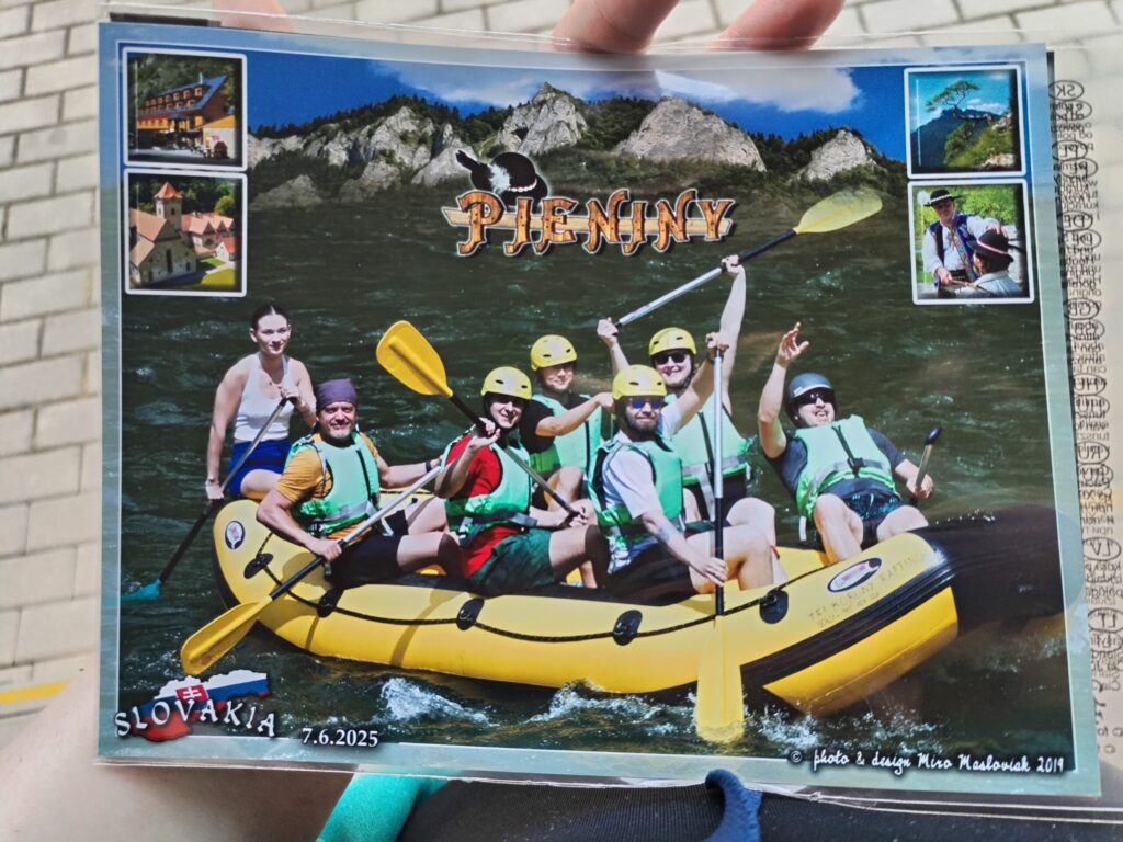 A postcard from Pieniny, Slovakia, dated June 7, 2025, showing a group of seven people rafting on a yellow inflatable boat in a river, surrounded by forested rocky mountains. Small inset images show local landmarks and traditional Slovak culture.